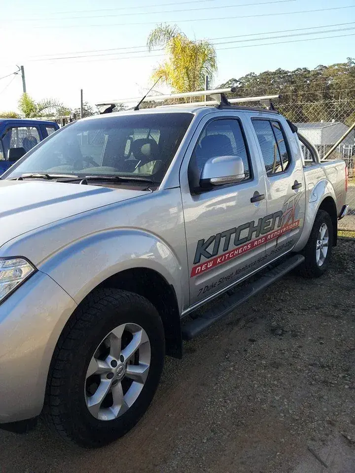 Kitchen FX branded work vehicle parked outdoors