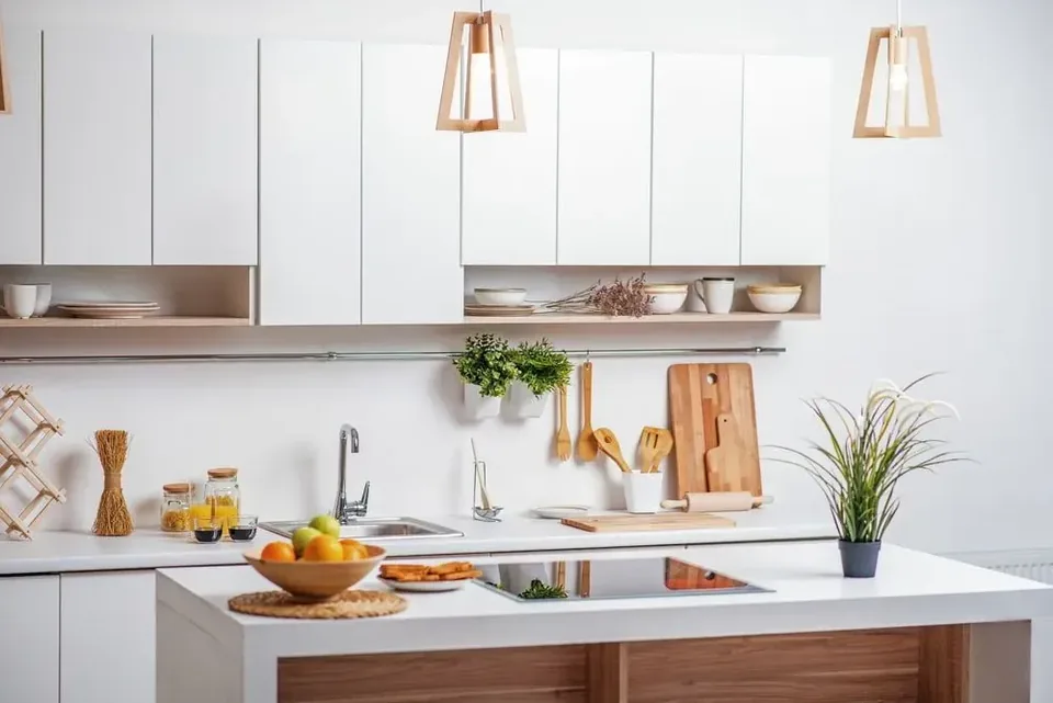 Modern white kitchen with timber accents, open shelf and white benchtop